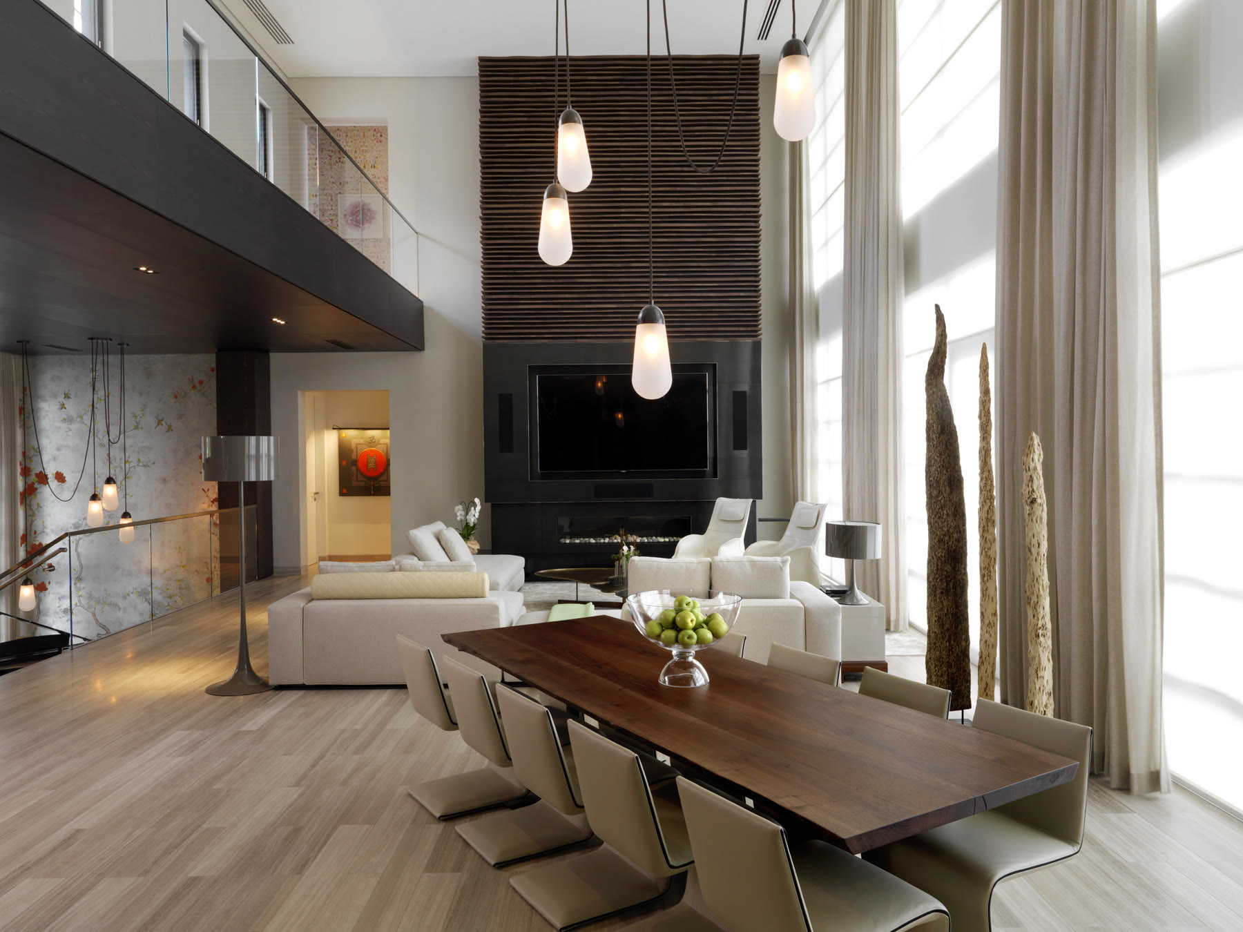 Dining and living, shades down. Residence by M2Develop