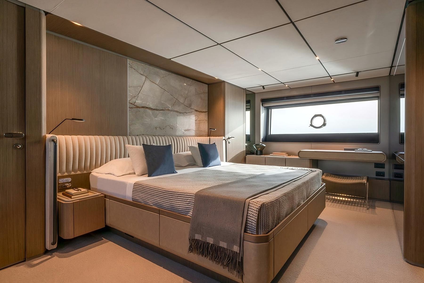 Owner's stateroom, stone panel. Yacht interior by M2Develop, Fort Lauderdale
