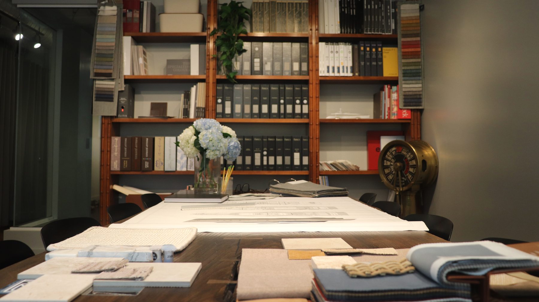 The M2Develop studio in Fort Lauderdale, with the materials library on the shelves.