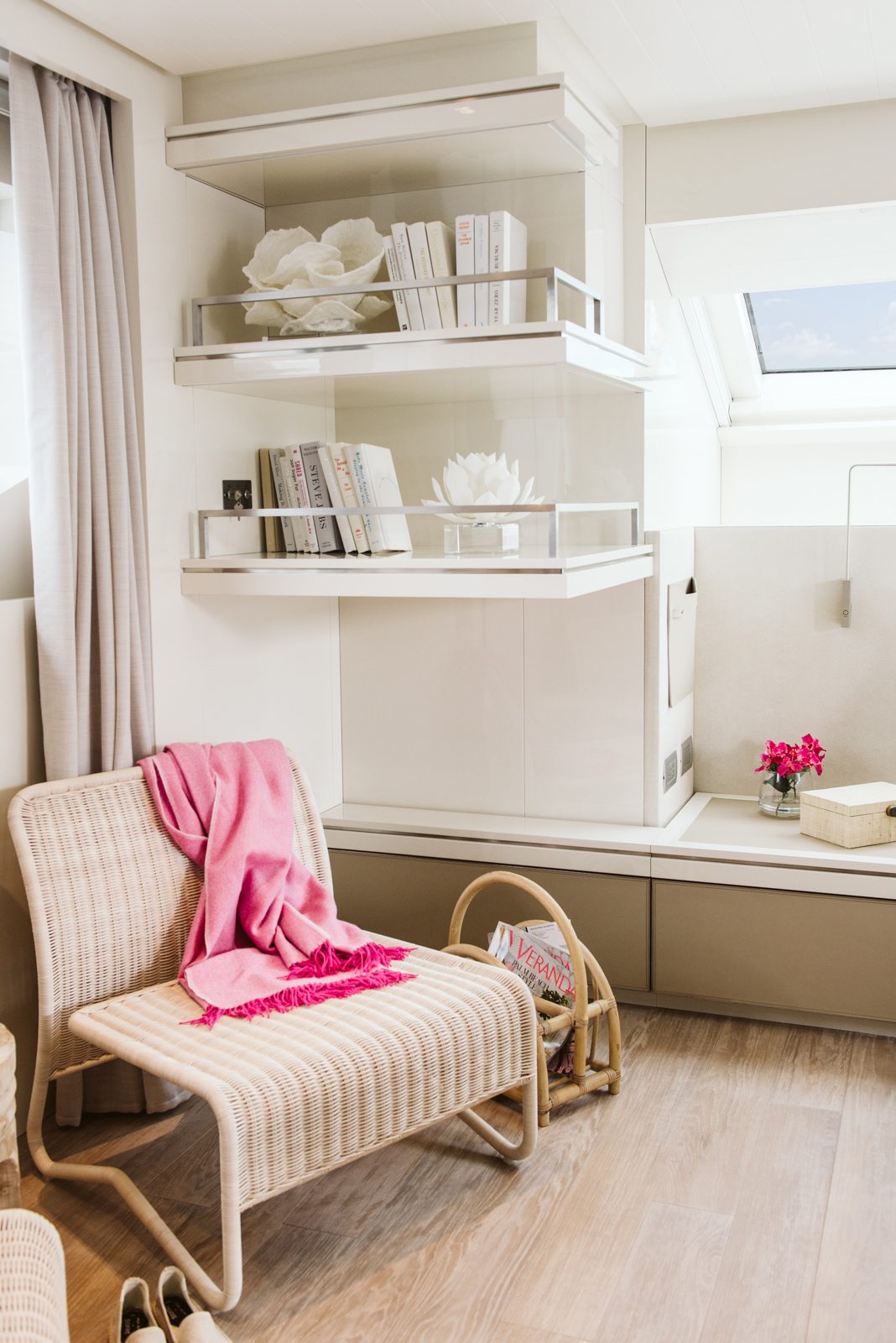 Wicker chair with a pink throw. Yacht interior by M2Develop, Fort Lauderdale